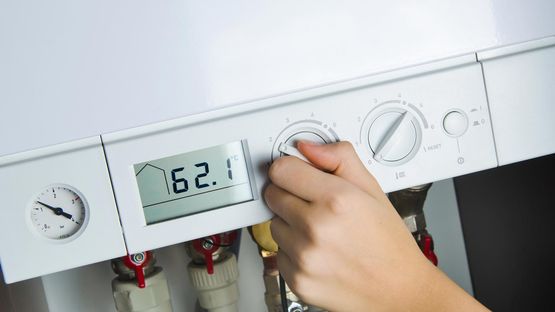 A boiler being turned up