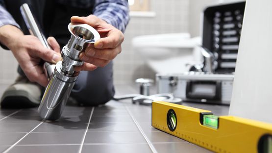 A plumber repairing a bathroom